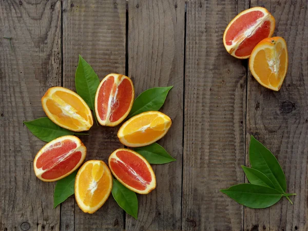 Oranges on a wooden background — Stock Photo, Image