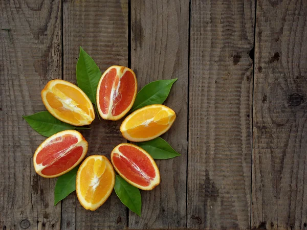 Oranges on a wooden background — Stock Photo, Image