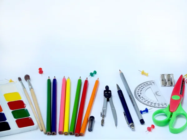 School supplies below border on white background — Stock Photo, Image