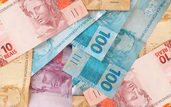 Brazilian Real banknotes background. Brazilian money. Economy, finance, savings concept.