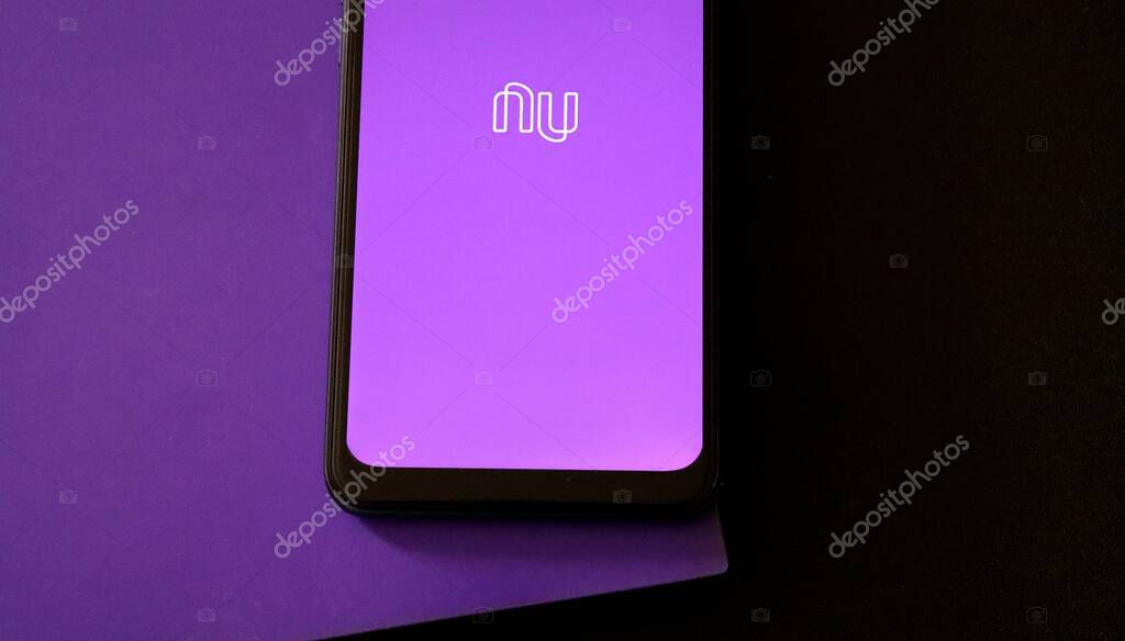 Bahia, Brazil - February 1, 2021: Nubank app on smartphone screen on office desk. Brazilian Digital bank.