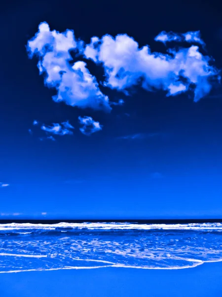 A dramatic seascape with ocean and clouds toned in blue.Graphic Design.Illustration