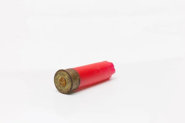 Red shotgun shell used.On white background. — Stock Photo, Image