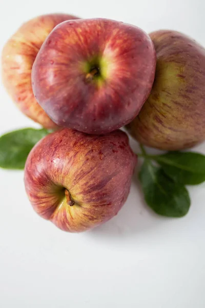 Big red apples on white background