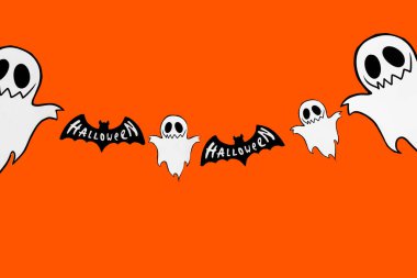 Cadılar Bayramı geçmişi. Turuncu arka planda. Hellwin mücevherleri. Harf