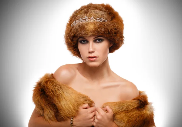 Portrait of a glamorous girl in a fur hat — Stock Photo, Image