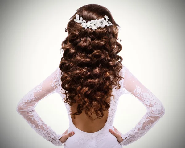 Brunette girl in white wedding dress back — Stock Photo, Image