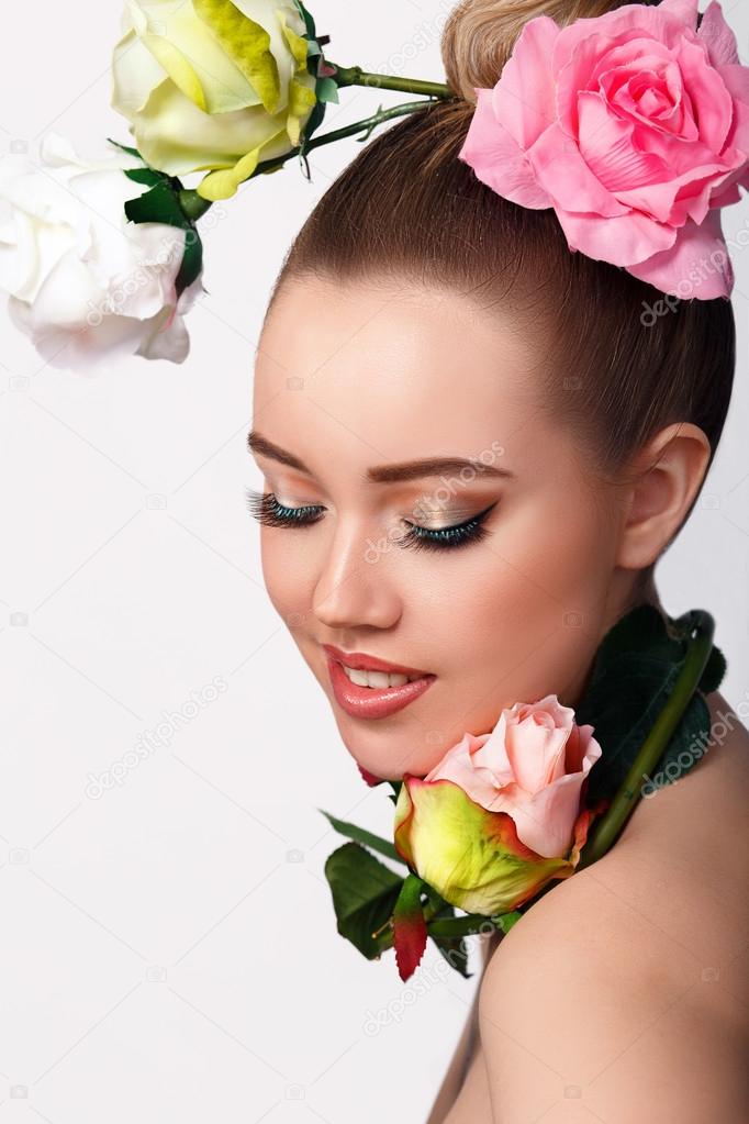 Fashion Beauty Model Girl with Rose Flowers Hair. Make up and Hair Style.   of Beautiful Flowers on lady's head Stock Photo by  ©nn-poter 62912307