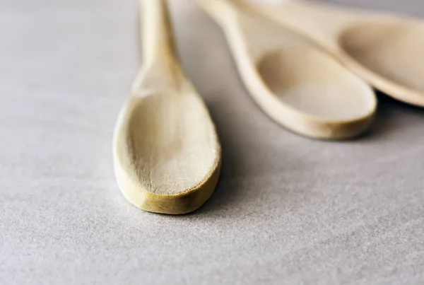 Group Wooden Kitchen Spoons Arranged Gray Marble Table Kitchen Utensils — Stock Photo, Image