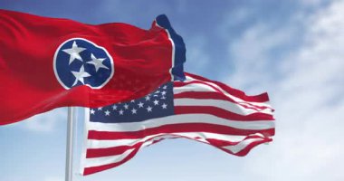 Tennessee eyaleti bayrağı açık bir günde Amerikan bayrağıyla dalgalanıyor. Kusursuz 3 boyutlu animasyon. Yavaş çekim döngüsü. Seçici odak