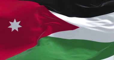 Jordan ulusal bayrağı rüzgarda dalgalanıyor. Siyah, beyaz ve yeşil yatay çizgiler, solunda kırmızı bir simge olan yedi köşeli beyaz bir yıldız barındırıyor. Kusursuz 3 boyutlu animasyon. Yavaş çekim döngüsü