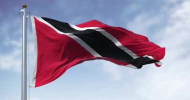 Trinidad ve Tobago ulusal bayrağı açık havada sallanıyor. Karayipler 'deki ada eyaleti. Kusursuz 3 boyutlu animasyon. Yavaş çekim döngüsü. Seçici odak
