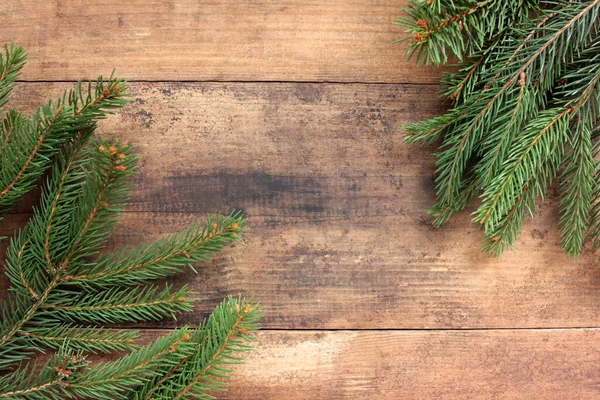Vánoční Pozadí Jedlovými Větvemi Rámeček Zimních Prázdnin Evegreen Větvičkami Dřevěném — Stock fotografie