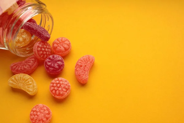 Sweet Fruit Hard Candies Pouring Out Glass Mason Jar Colored — Stock Photo, Image