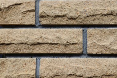 Gri tuğla duvar arka planı. Beton dokuda yeni bloklar. Boşluğu kopyala