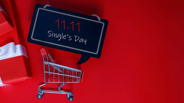 Online shopping of China, 11.11 single\'s day sale concept. The red gift boxes on red background with copy space for text 11.11 single\'s day sale.