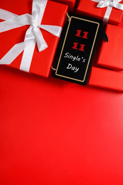 Online shopping of China, 11.11 single\'s day sale concept. The red gift boxes on red background with copy space for text 11.11 single\'s day sale.