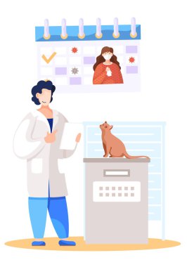 Veteriner, veteriner kliniğinde kediyi muayene masasında tutuyor. Koronavirüs salgını sırasında karantina