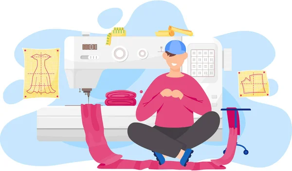 Jeune homme créateur de mode fait un modèle, assis près de la machine à coudre avec tissu rose — Image vectorielle
