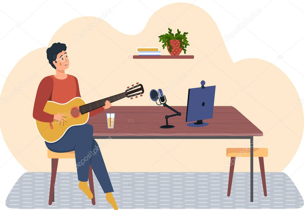 Person with guitar looks at computer monitor. Man sings song into microphone and records audio