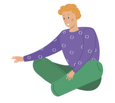 Yerde oturan adam bir şeye uzanıyor. Adam bacaklarıyla oturur ve ileriye bakar.