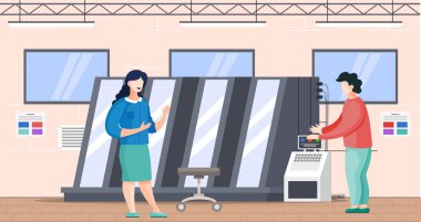 Baskı şirketi çalışanları makineyle çalışır. Tipografi iletişiminde çalışan meslektaşlar