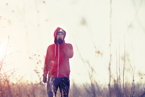 Portrait of men runner in the field with headlamp — Stock Photo, Image