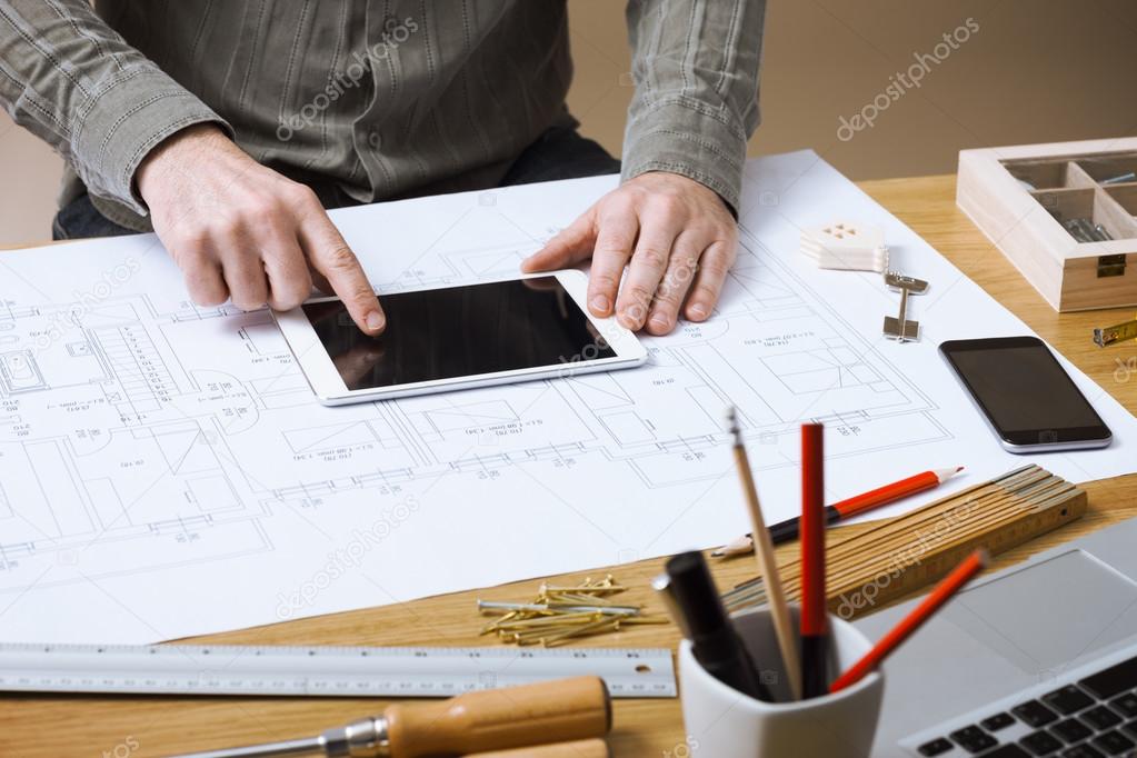 Professional architect working at his desk