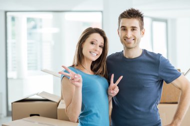 Loving couple posing in their new house