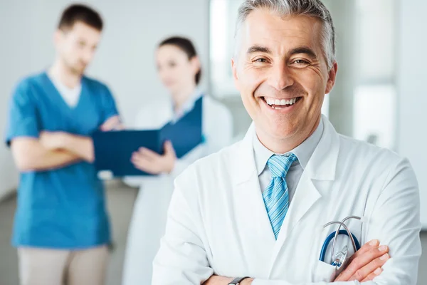 Confident doctor at hospital posing — Stock Photo, Image