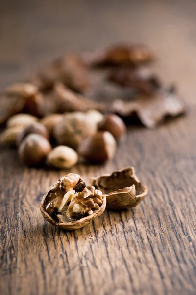 Nuts on hardwood table — Stock Photo, Image