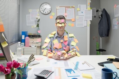 Office worker covered with stick notes clipart