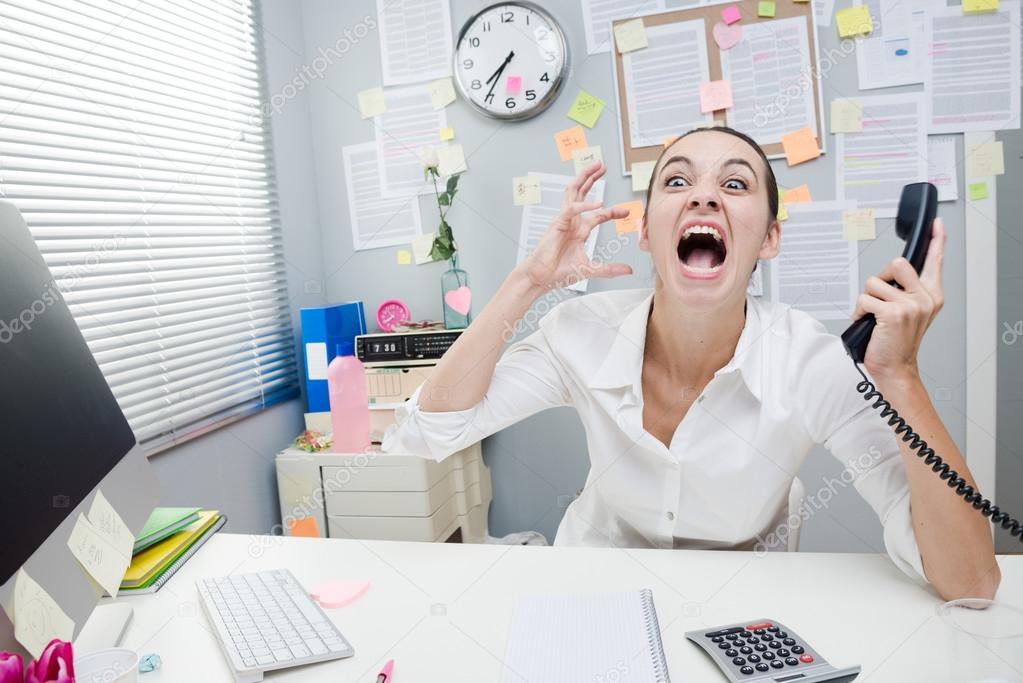 Businesswoman shouting at phone