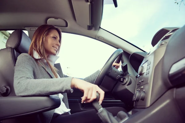 Young smiling woman driving Stock Image