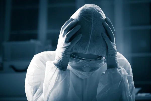 Terrified scientist in hazmat suit — Stock Photo, Image