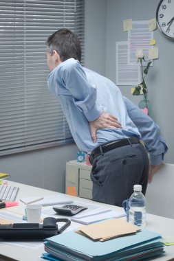 Tired business with back pain clipart