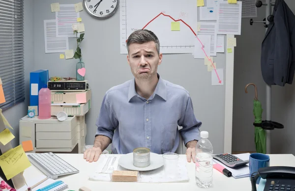 Businessman having a sad lunch — Stock Photo, Image