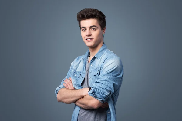 Young teenager posing with arms crossed — Stock Photo, Image