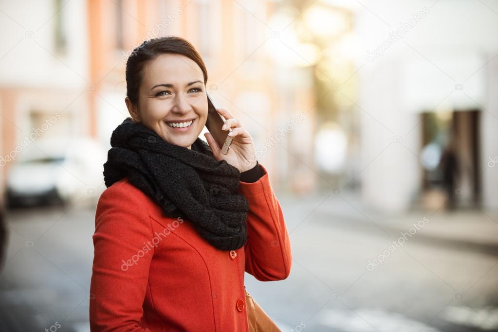 Confident woman walking in the city