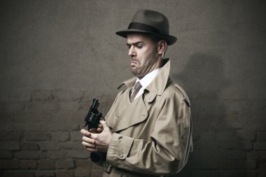 Silly vintage detective with a gun clipart