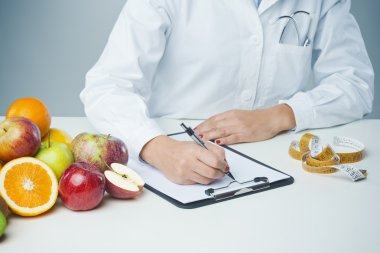 Female nutritionist at work clipart