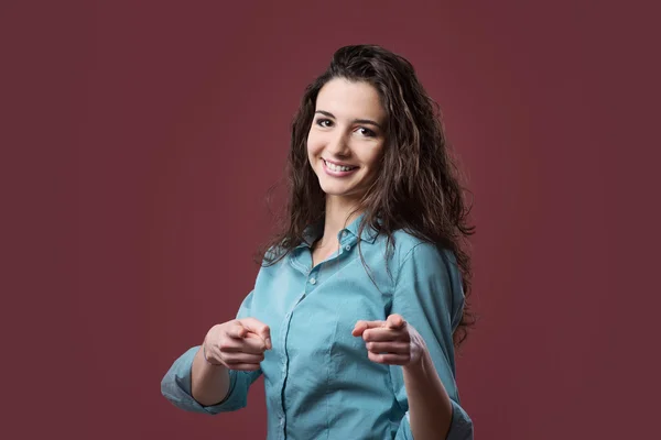 Cheerful woman pointing forward — Stock Photo, Image