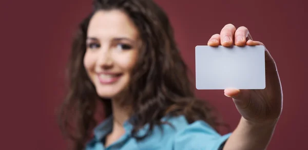 Young woman holding a business card Stock Image