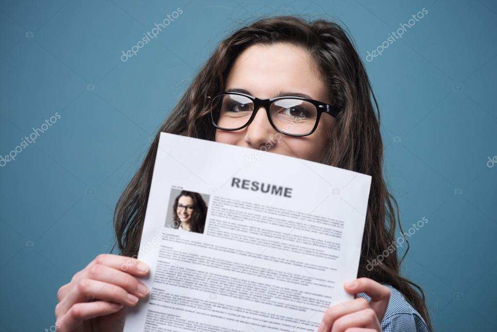 Young woman holding her resume