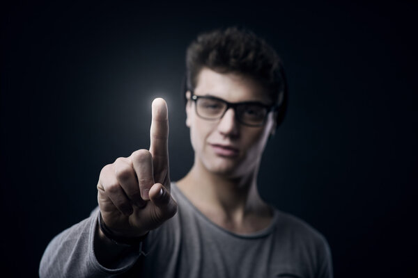 Teenager using touch screen interface