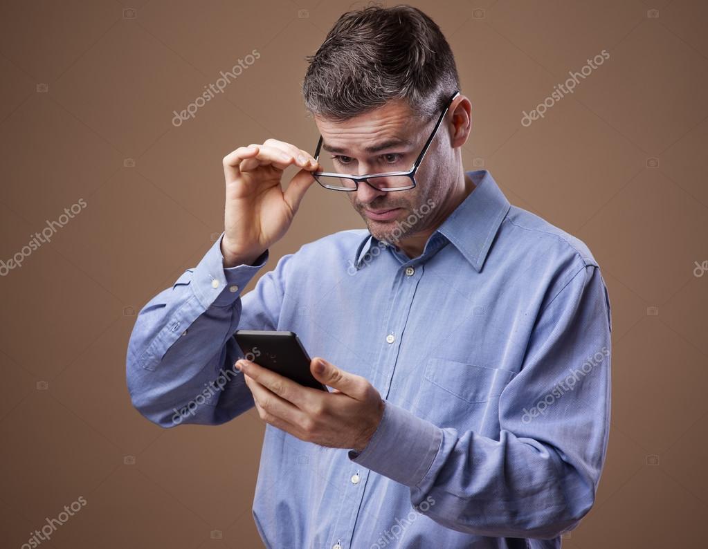 Man adjusting his glasses Stock Photo by ©stockasso 68581371