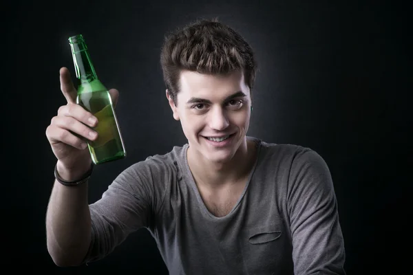 Handsome guy having a beer — Stock Photo, Image