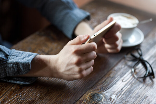 Coffee break with mobile phone