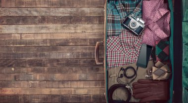 Hipster traveler's suitcase