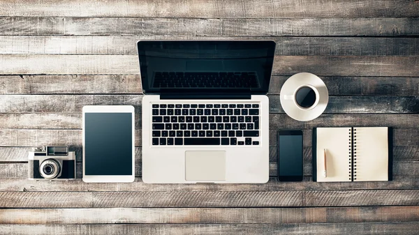 Vintage grunge desktop with laptop — Stock Photo, Image